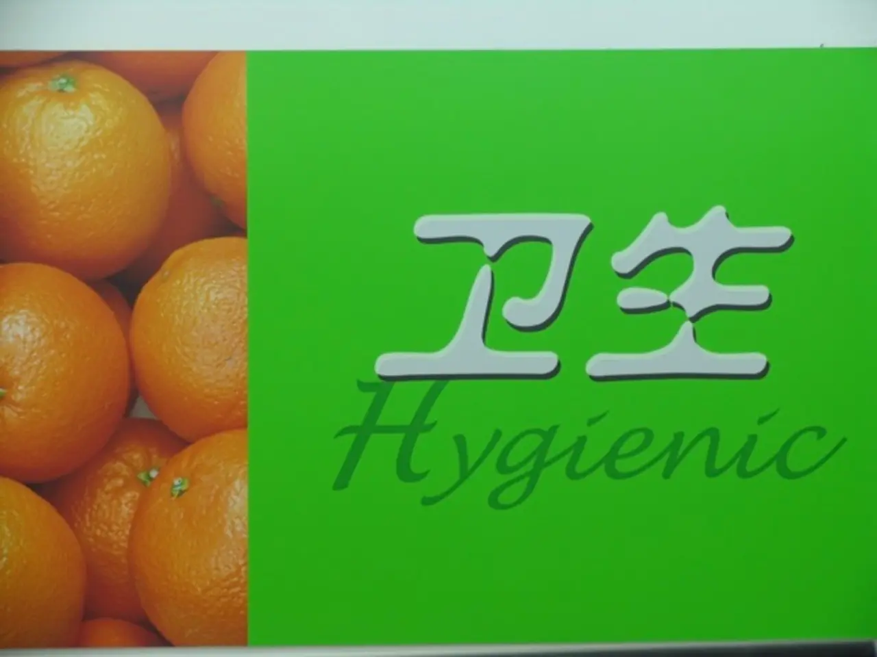 In this image there is a photo of oranges and there are two words on the paper.