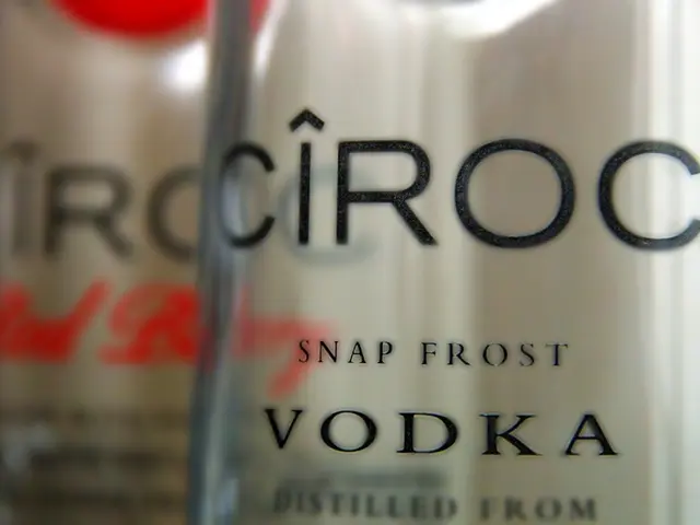 In this image we can see bottles with some text.