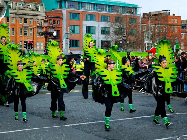 In this image, there are some persons wearing fancy dresses and walking on the road. There is a...