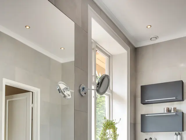 This picture describes about inside view of a room, in this we can find a tap, wash basin, mirrors...