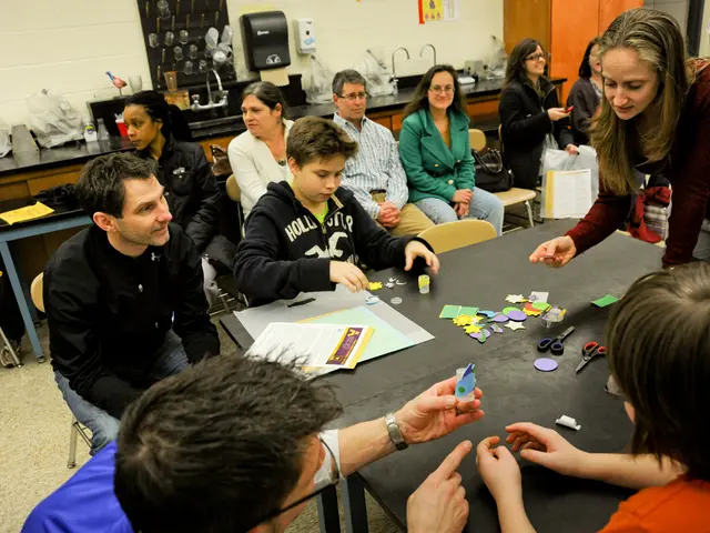 In this image I can see in the middle a group of people are sitting on the chairs. On the right...